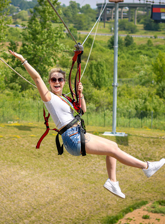 Young female soaring on Zipline