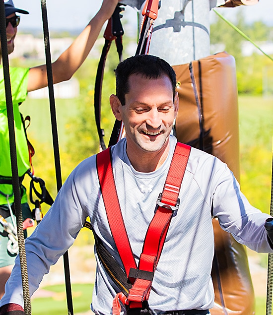 man enjoying a birthday adventure on the st louis ropes course at Ryze