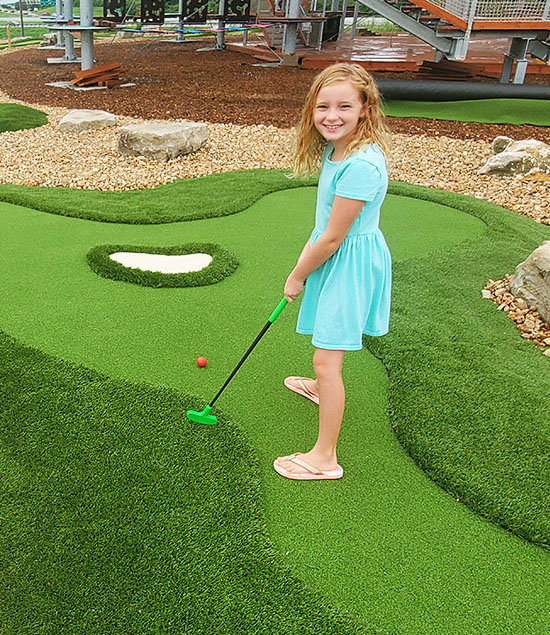 young girl putting