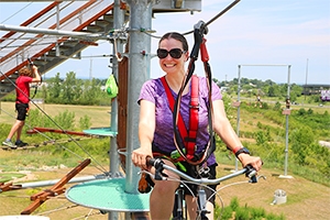 woman riding a bike on the adventure tower