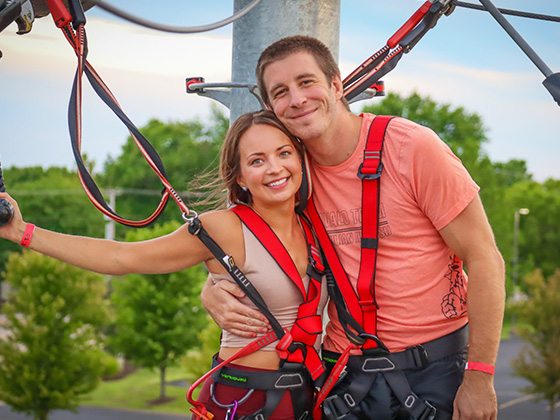 couple embracing in love during date night event on ropes course