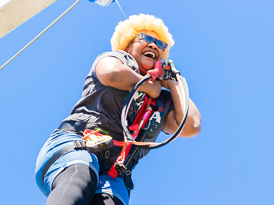 Lady jumping off the tower from the free fall platform